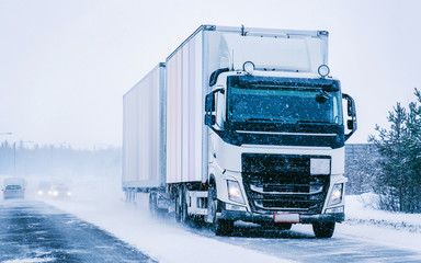 Wall Mural - Truck in the Snowy winter Road in Finland of Lapland reflex