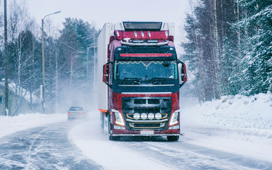 Wall Mural - Truck on the Snowy winter Road at Finland in Lapland reflex