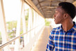 © Ranta Images - Young handsome African man exploring the city