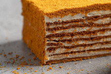 layer cake on a black background, homemade honey cake , dark background