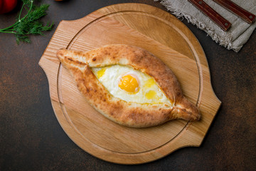 ajara Khachapuri georgian kitchen on brown concrete table