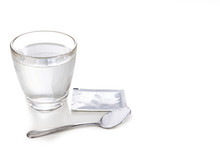 ORS Or Oral Rehydration Salt With Glass Of Water, Sachet And Spoon