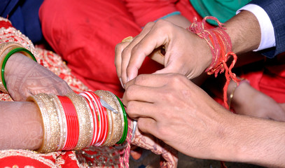 Wall Mural - Indian couple playing Ring Fishing game in wedding ceremony of India