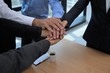 Business teamwork colleague top view putting join hands together for company office project concept with selective focus
