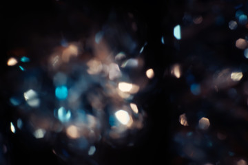 Canvas Print - Dark Abstract blue bokeh sparkle on black background