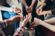 © Photographee.eu - Close-up of hands of people sitting in a circle during a therapy group meeting
