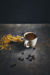 Wall Mural - Cup of strong turkish coffee and cane sugar on rustic background. Copy space