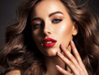 © Valua Vitaly - Beautiful face of an attractive model with red lipstick.