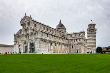 Wall Mural - The beautiful Pisa Cathedral, a notable example of Romanesque architecture with the famous  Leaning Tower of Pisa, Tuscany, Italy.