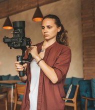 Professional Woman Videographer With Gimball Video Slr