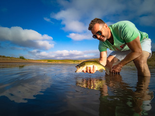 Wall Mural - Big Bass Large mouth - Fishing on lake