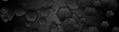 Black hexagons on dark perforated metallic background. Abstract technology banner design. Vector illustration