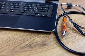 hospital workstation with stethoscope and pencil