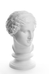 Gypsum copy of ancient statue Venus head isolated on white background. Plaster sculpture woman face.