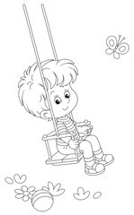 Wall Mural - Cheerful small boy swinging on a summer playground in a park, black and white outlined vector cartoon illustration for a coloring book page