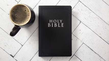 Canvas Print - A Black Bible on a White Wooden Table for a Bible Study