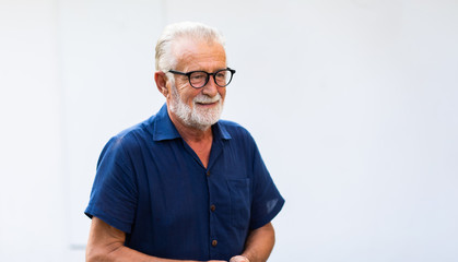 Wall Mural - family time together at home concept. lifestyle. Portrait of happy and handsome bearded senior man in glasses enjoy nature garden at home. Elder man