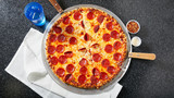 Fototapeta Natura - A classic and delicious whole pepperoni pizza
