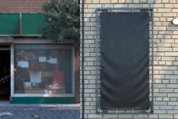 Wall Mural - Blank Black Vertical Outdoor Vinyl Textile Banner at Bright Brick Wall. Mock up. Copy Space. Empty Space. 3d rendering