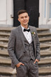 © Wedding photography - Portraip of elegant groom in grey suit at wedding day
