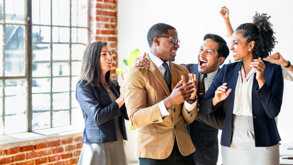 Team of business people clapping