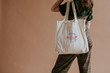 © rawpixel.com - Model holding a canvas bag