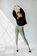 Wall Mural - Model posing in a natural light studio