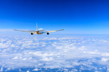 Commercial airplane flying above the clouds,travel concept.