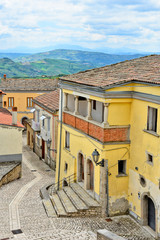 A small road between the old houses of Buonalbergo, a village in the province of Benevento