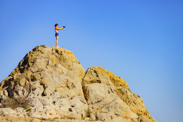 Poster - Woman with camera take travel photo