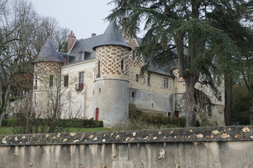 Wall Mural - old stone and red brick castle with towers in the park in the Loire, France