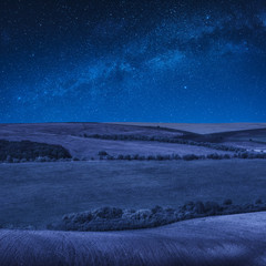 Wall Mural - Colorful rolling spring fields at night