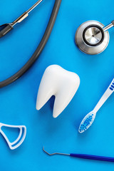 Wall Mural - Dental model and dental equipment on blue background, concept image of dental background. dental hygiene background