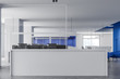 Reception in white and blue open space office