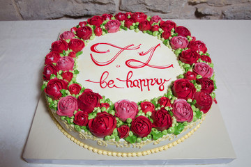 Wall Mural - Red flower cake. Be happy . Round yellow cake.