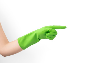 Hand with green rubber protective glove points to the side right, isolated on white gesturing, signs of gestures (language), gloves cleaning, kitchen gloves.