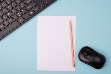 Working near computer concept. Top above close up overhead view photo of sheet of paper computer keyboard and wireless mouth isolated over blue desk background with copy empty blank space