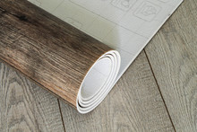 Roll Of Linoleum With A Wood Texture. Types Of Floor Coverings. 