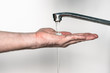Washing of hands with soap under running water. on a white background