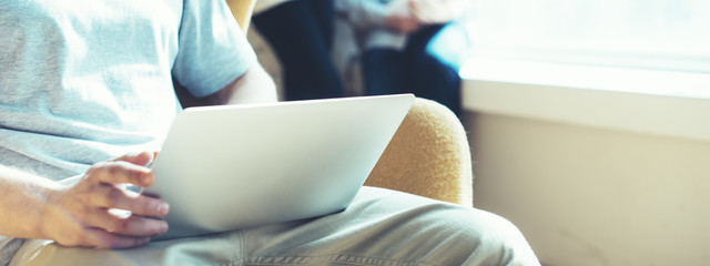 Fototapete - young business team working in loft office. man with stubble using laptop. digital startup.wide scre