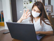 © Kenstocker - women wearing hygienic mask to prevent the covid-19 or Coronavirus and using computer labtop for work from home, stay on home stop the spread of the virus concept.