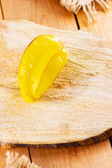 Wall Mural - Carambola on the wooden boards. Star Fruit (Averrhoa carambola L.) on burlap. Yellow fruit carambola on the sackcloth