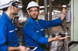© Shutter B - Group of Industrial factory maintenance engineers inspect relay protection system of machinery. Industry, Maintenance, Engineering and construction concept.
