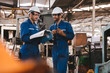 © Shutter B - Group of industrial factory maintenance engineers inspect relay protection system using walkie talkie with copy space for your text. Industry, Maintenance, Engineering and construction concept.
