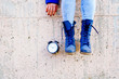 © FATIR29 - black alarm clock in a woman's hand on the background of nature. timeless and time concept image with beautiful woman taking a big vintage old black alarm and show to you the minutes going away. live