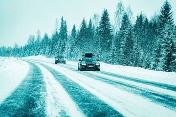 Poster - Car with roof rack in winter snowy road at Rovaniemi reflex