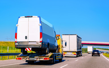 Sticker - Tow truck transporter carrying mini van in Road in Slovenia reflex