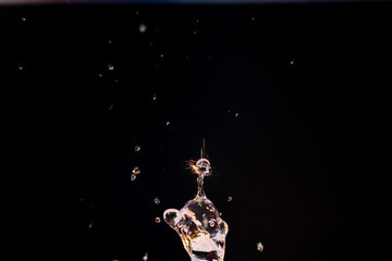 Wall Mural - High speed macro photography of a water drop splashing