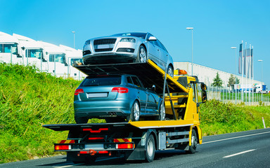 Canvas Print - Cars carrier on road reflex