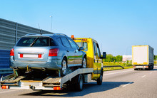 Tow Truck Transporter Carrying Car On Road In Slovenia Reflex